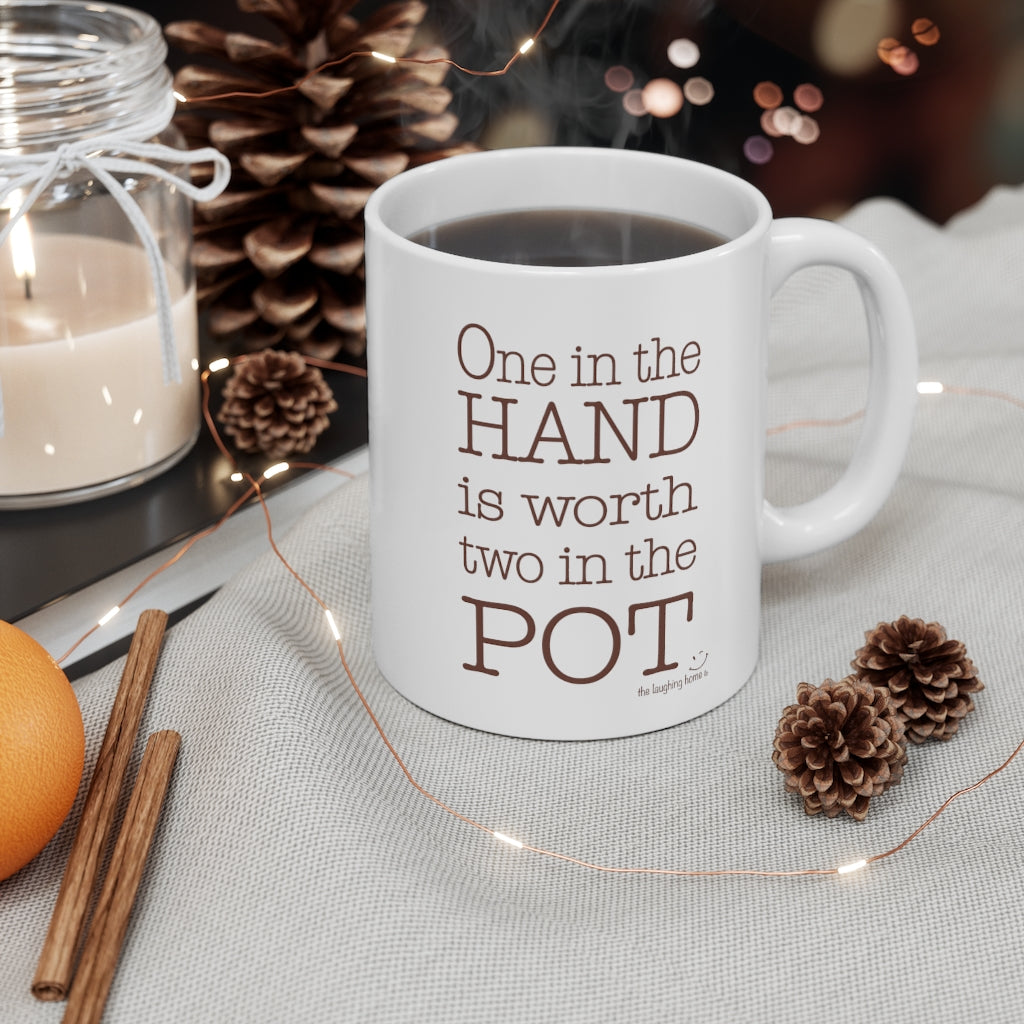 One in the hand is worth two in the pot Ceramic Mug 11oz