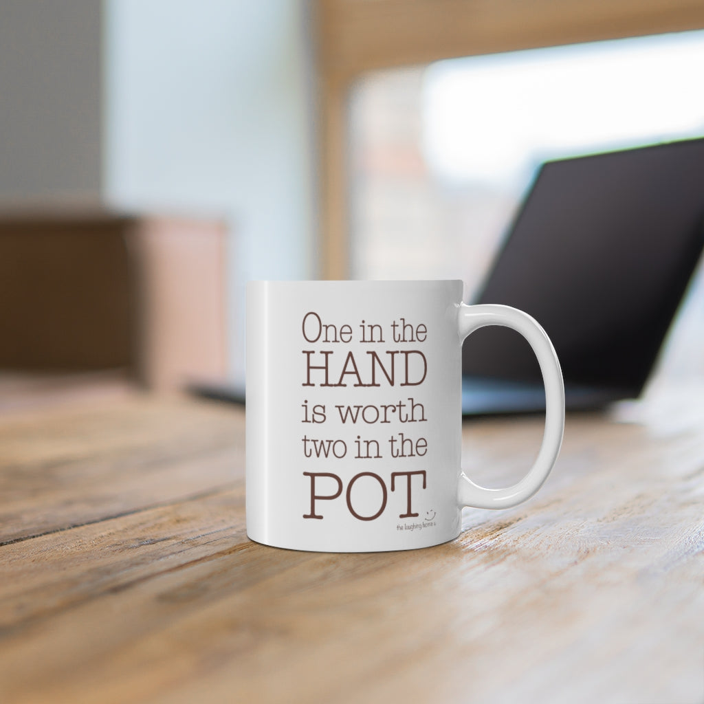One in the hand is worth two in the pot Ceramic Mug 11oz
