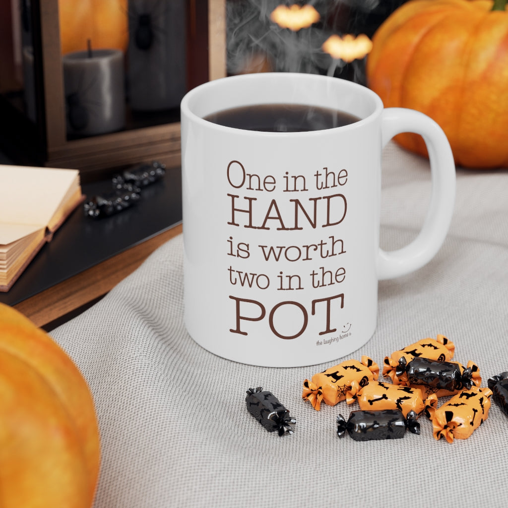 One in the hand is worth two in the pot Ceramic Mug 11oz